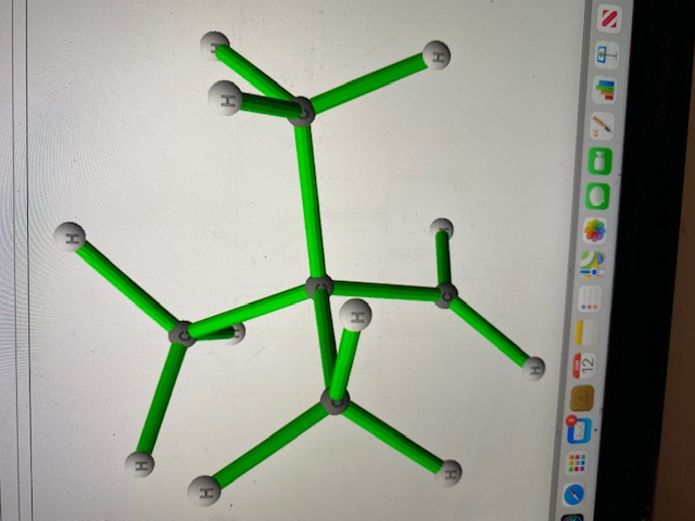 This image depicts the 3D structure of a cyclohexane molecule. Cyclohexane is a cyclic alkane with the molecular formula C6H12, forming a six-membered carbon ring. Each carbon atom is bonded to two hydrogen atoms, maintaining a tetrahedral geometry around each carbon for optimal sp3 hybridization angles of approximately 109.5 degrees. 

In the displayed model:
- The green sticks represent the covalent bonds between the atoms.
- The grey spheres represent carbon atoms.
- The white spheres represent hydrogen atoms.

Each carbon atom in the cyclohexane ring is part of two bonds with other carbons and two bonds with hydrogen atoms, forming a total of four sigma bonds per carbon atom. The molecular model might also help students understand chair and boat conformations, where cyclohexane adopts puckered, non-planar shapes to reduce angle strain and torsional strain. 

This visualization aids in comprehending the three-dimensional geometry and spatial arrangement, which is fundamental in understanding organic molecule structures and their properties.