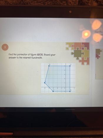 **Title: Calculating the Perimeter of Figure ABCDE**

**Objective:**
Find the perimeter of figure ABCDE. Round your answer to the nearest hundredth.

**Description:**
This task involves determining the perimeter of a polygon labeled as ABCDE on a coordinate grid.

**Diagram Explanation:**
- The coordinate plane shows a polygon with vertices marked A, B, C, D, and E.
- The coordinates of the points are approximately:
  - A at (-3,0)
  - B at (0,4)
  - C at (3,4)
  - D at (3,0)
  - E at (-5,0)

**Instructions:**
1. Calculate the distance between each pair of consecutive vertices using the distance formula: 
   \[
   \text{Distance} = \sqrt{(x_2 - x_1)^2 + (y_2 - y_1)^2}
   \]
2. Add all the distances together to find the total perimeter.
3. Ensure the final answer is rounded to the nearest hundredth for precision.

**Mathematical Steps:**
- Compute the lengths of the line segments AB, BC, CD, DE, and EA.
- Sum these lengths to obtain the perimeter.

This exercise helps in applying the distance formula and practicing arithmetic operations like addition and rounding. It is designed to enhance understanding of geometric properties and coordinate plane analysis.