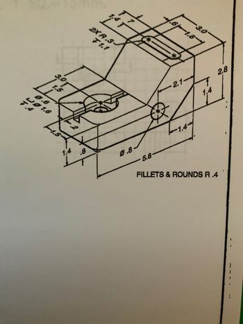 The image depicts a detailed technical drawing of a mechanical part. The part seems to be a block-like structure with several dimensions and features annotated.

**Key Features:**
- **Dimensions**: 
  - The overall height of the block is 2.8 units.
  - The length of the block is 9.0 units, with a section measuring 1.8 units at the top.
  - The width of the block at the top is 3.0 units, and there is an indentation 1.5 units deep on the side.
  - A smaller section on top has dimensions of 1.4 units by 2.1 units.
  - Internal features include a circular pocket with a diameter of 9.6 units, and a smaller circle of diameter 6.4 units.

- **Edges and Fillets**:
  - The corners and edges are rounded and filleted with a radius of 0.4 units.

- **Additional Details**:
  - There are two holes labeled "2X f 3," indicating their repetition and specification.
  - Other labeled distances indicate the relative positioning of features within the part, ensuring precise manufacturing.

This technical drawing serves as an instructional example in understanding and interpreting mechanical design blueprints, focusing on dimensions, features, and specifications that are crucial for manufacturing.