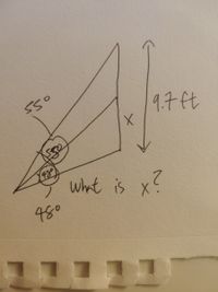 The image displays a hand-drawn diagram involving two adjacent triangles. Here's a detailed explanation:

### Diagram Description:

1. **Triangles:**
   - Two right triangles are depicted, sharing a common hypotenuse.
   - The smaller triangle is nested within the larger triangle.

2. **Angles:**
   - The smaller triangle has an angle marked as \(55^\circ\).
   - The larger triangle has an angle marked as \(48^\circ\).

3. **Dimensions:**
   - The vertical leg of the larger triangle is labeled as \(9.7\) ft.
   - The vertical leg of the smaller triangle is labeled \(x\).

4. **Question:**
   - The diagram asks, "What is \(x\)?"

This setup is often used to explore trigonometric relationships or to apply the law of sines or cosines for angle and side calculations in triangles.