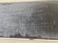 ### Continuity of Product of Continuous Functions

This blackboard contains a proof related to the continuity of the product of two functions. Here is a transcription and explanation of the content:

1. **Definitions and Assumptions:**
   - Functions \( f, g \) with domain \( D \subset \mathbb{R}^p \) are continuous, where \( a \in \mathbb{R}^p \).
   - The focus is on proving that \( f \cdot g \) is continuous at \( a \).

2. **Proof Structure:**
   - **Continuity Condition:** For \( f \) and \( g \) to be continuous at \( a \):
     - Given \( \varepsilon > 0 \), there exists \( \delta_1 > 0 \) such that for all \( x \in \mathbb{R} \), if \( \| x - a \| < \delta_1 \), then \( \| f(x) - f(a) \| < \varepsilon \).
     - Similarly, there is \( \delta_2 > 0 \) such that \( \| g(x) - g(a) \| < \varepsilon \).
   - **Combined Condition:** Choose \( \delta = \min(\delta_1, \delta_2) \). Thus, if \( \| x - a \| < \delta \), both continuity conditions are satisfied.

3. **Mathematical Expression:**
   - Shown centrally is a bound expression for the product of \( f \) and \( g \):
     \[
     \| f(x) \cdot g(x) - f(a) \cdot g(a) \|
     \]
   - This expression expands using properties of modulus and distribution:
     \[
     = \| (f(x) - f(a)) \cdot g(a) + f(x) \cdot (g(x) - g(a)) \|
     \]
   - Further breaking down:
     \[
     = \| (f(x) - f(a)) \cdot g(a) \| + \| f(x) \cdot (g(x) - g(a)) \|
     \]

This proof demonstrates that if \( f \) and \( g \) are continuous at a point \( a \), then their product \( f \cdot g \